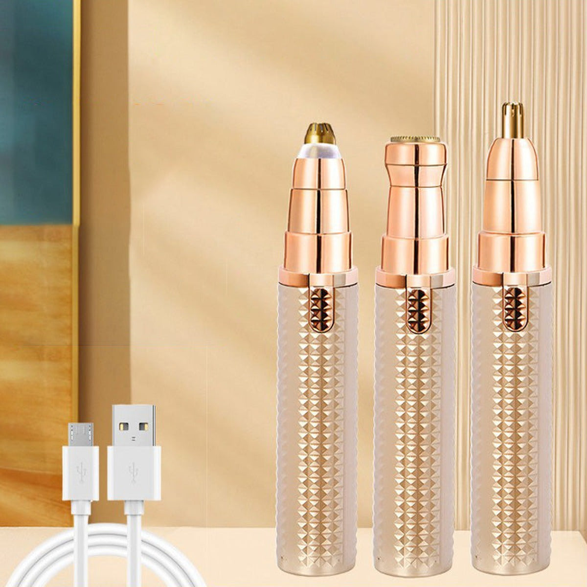 Tre trimmere med forskellige hoveder og USB-ladekabel