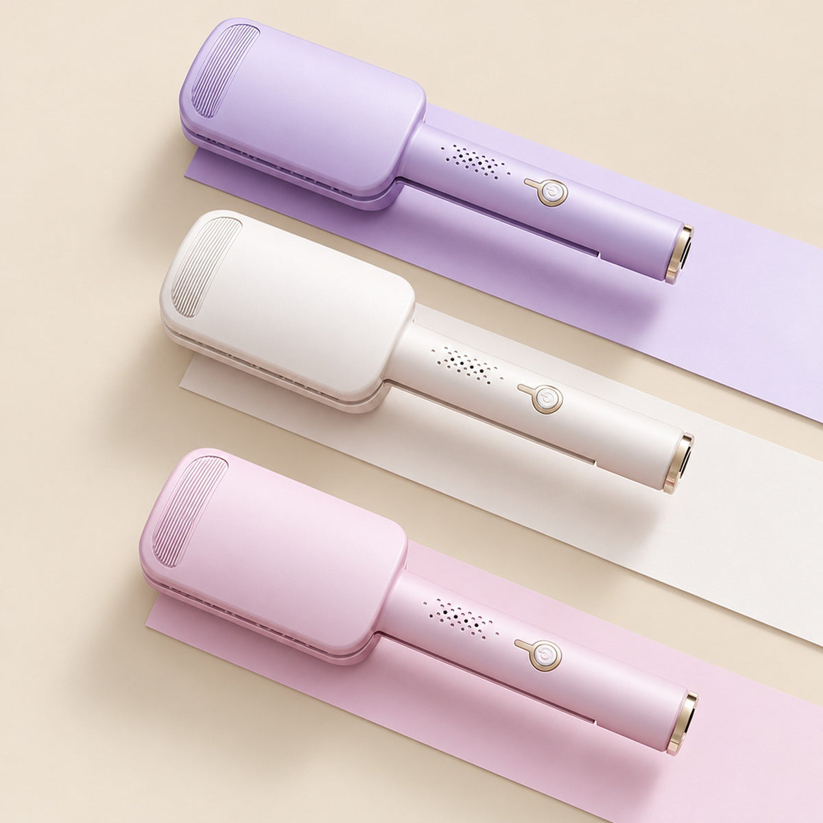 Tre locktänger i lila, beige och rosa från ovan